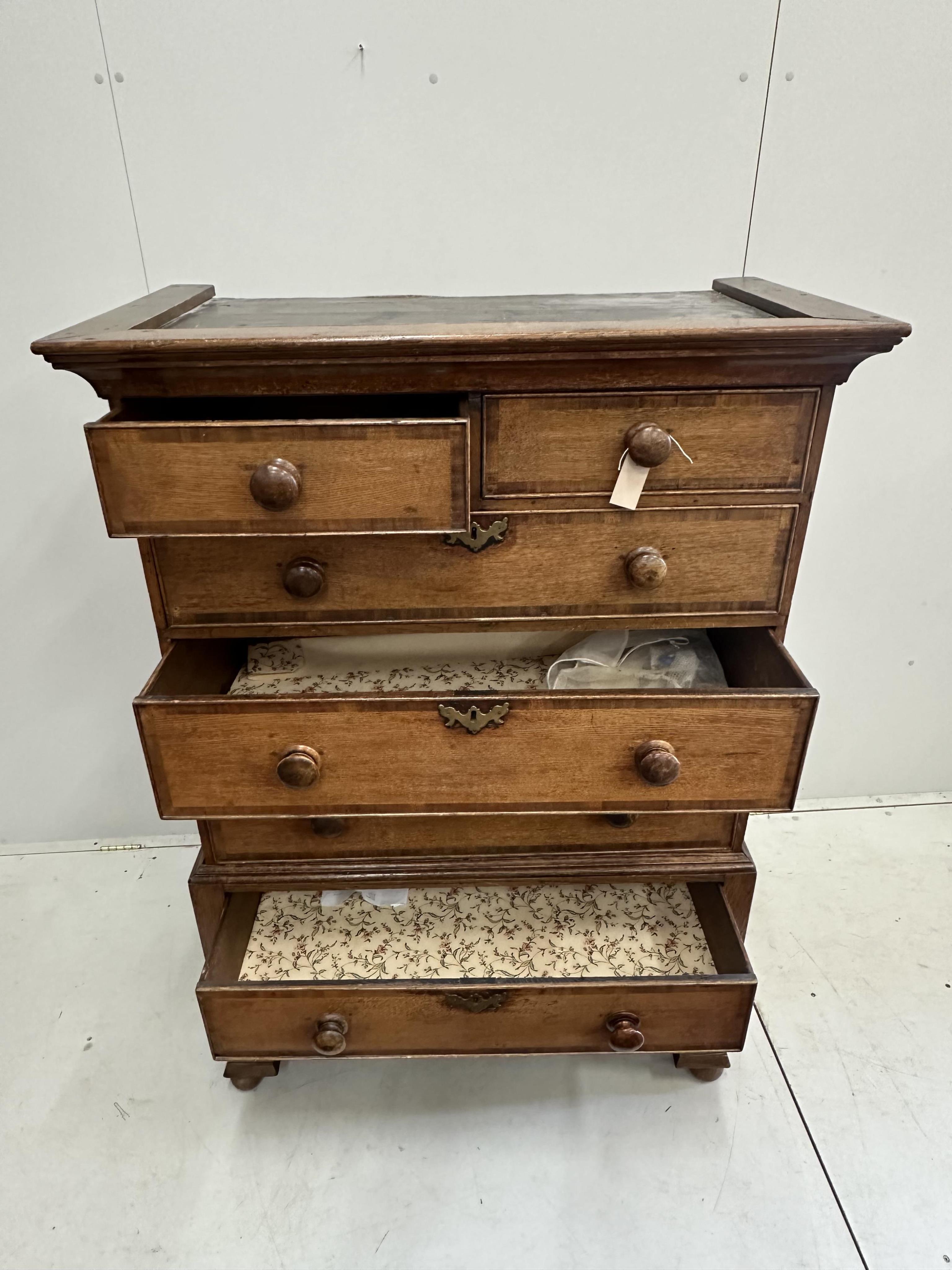 A George IV banded oak chest on stand, width 103cm, depth 56cm, height 146cm (altered). Condition - fair